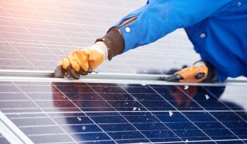 Cropped horizontal shot of a male worker installing solar panels on a power plant using elternative renewable energy copyspace modern technology nature environment concept.